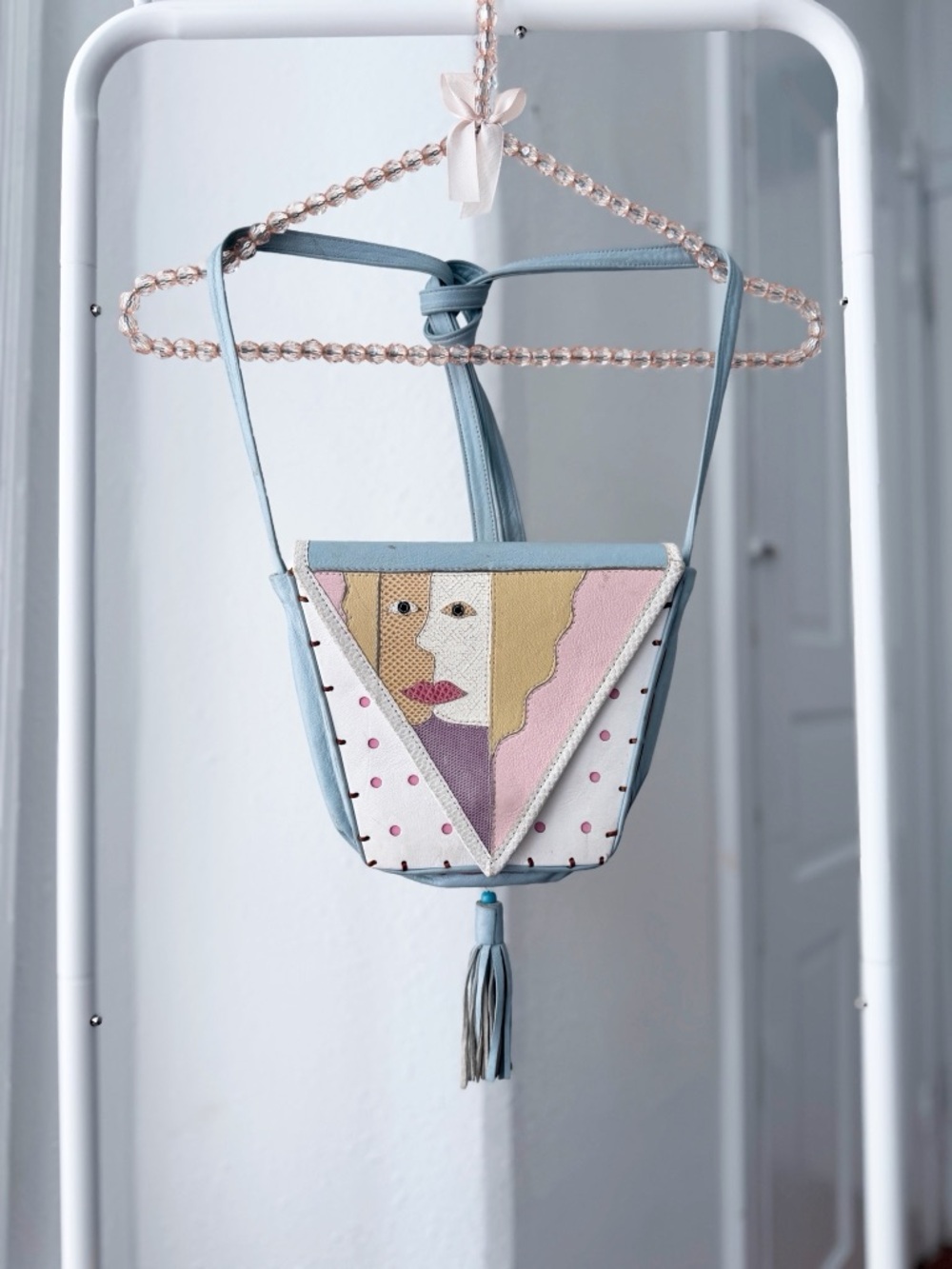 Vintage handcrafted patchwork leather abstract face pastel tassel purse